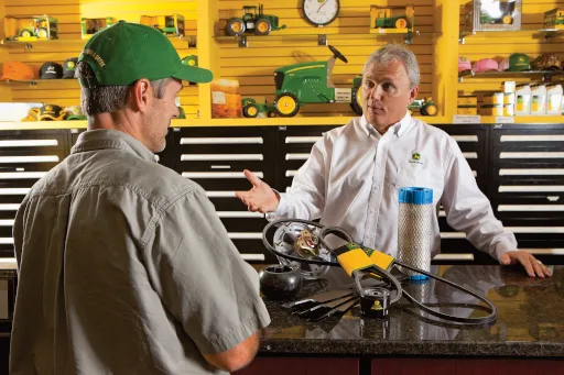 Conversation between two men at parts counter